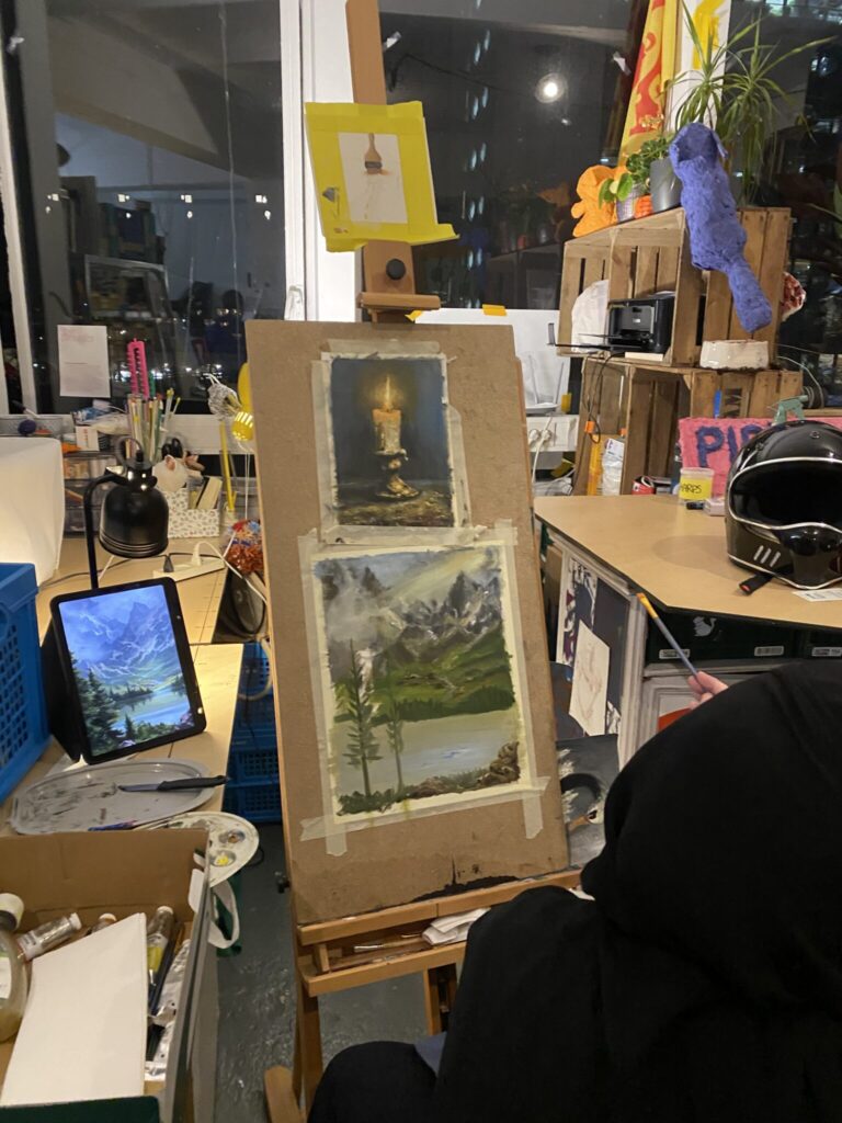 The Khan family with their children doing creative projects at Sketchbook Club in Rotterdam.