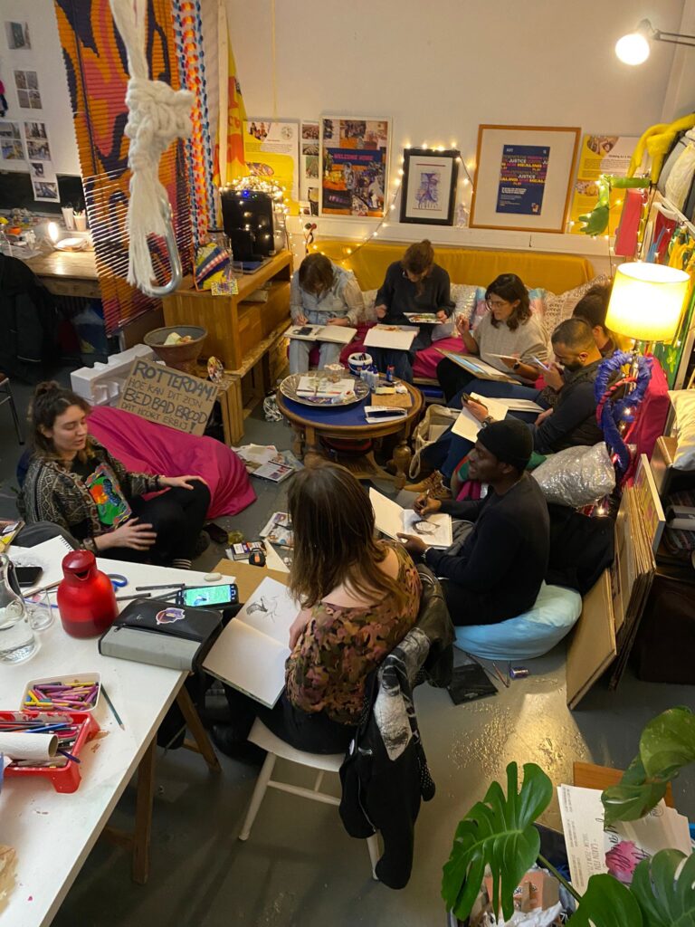 Sheila and Max participating in a collaborative sketchbook session.