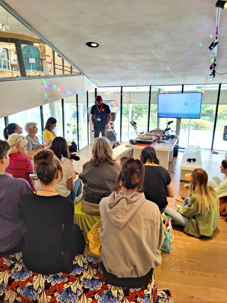Students and volunteers creating radio programmes during AYCA 2024 summer school.